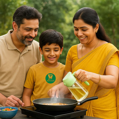 Family cooking together outdoors, with a woman pouring oil into a pan using 2 in 1 oil dispenser